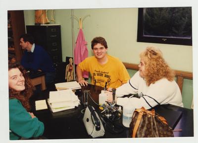 Students conversing in a laboratory classroom