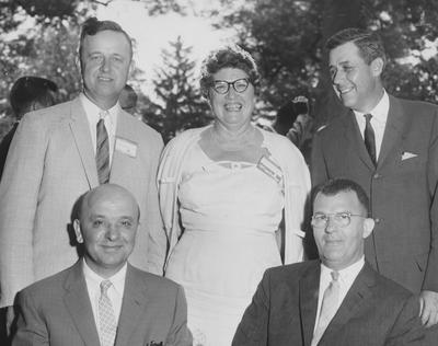 Smith Broodnet (standing, left), Mrs. Hampton Adams (center) and three unidentified men are all University of Kentucky Alumni officers; photo from Lexington Herald-Leader. Received on November 3, 1990 from Public Relations