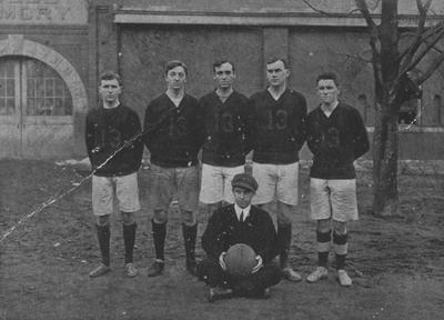 Unidentified members of the junior basketball team, in front of Buell Armory; photo appears on page 161 in the 1912 Kentuckian