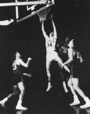 Basketball game action, UK versus Temple; Ed Beck takes a shot for a goal; photo appears on page 206 in the 1958 Kentuckian