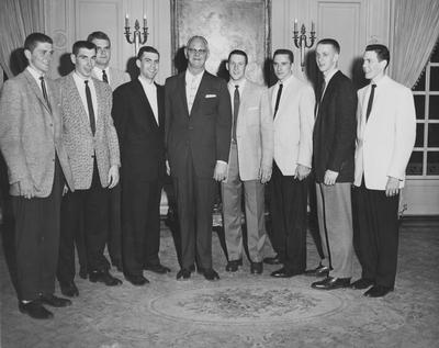 Basketball team members, 1958 championship season, (left to right) unidentified, Lincoln Collinsworth, Dick Howe, unidentified, Bernie Shively (Athletics Director), Adrian Smith, Harold Ross, unidentified, unidentified