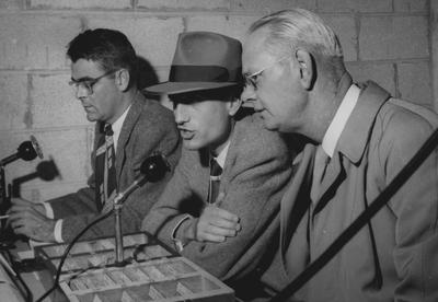 Ben Williams, J. B. Faulconer, 1939 journalism graduate and creator of first UK sports information and broadcast network, and Bernie Shively (left to right), UK Athletics Director, pictured in press box during game; photo received May 5, 1965 from the Lexington Herald-Leader