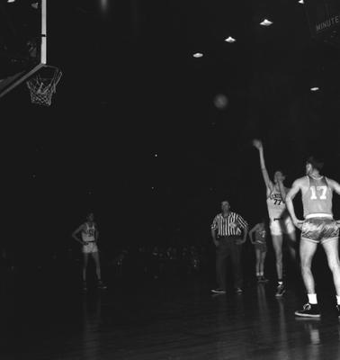 Basketball game action; Bill Spivey takes a foul shot as Read Morgan (36) watches from left, at Memorial Coliseum