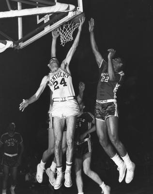 Basketball game action; Johnny Cox (24) taking a shot against Seattle
