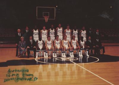 UK Men's Basketball team, December 1979; seated far left, Jane S. Rollins, to her left, coach Joe B. Hall
