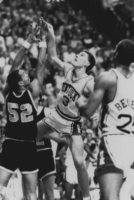 Basketball game action, UK versus unidentified opponent; Rex Chapman (3) takes a shot