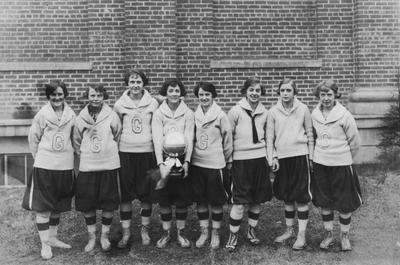 Unidentified members of a women's basketball team; the letter 