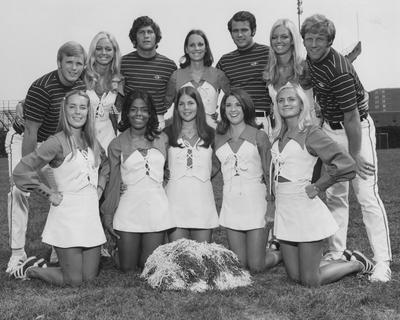 Cheerleading team photo, all unidentified except the Barnstable twins, back row, who did commercials and traveled with Bob Hope to Vietnam. Received March 19 1984 from Photographic Services