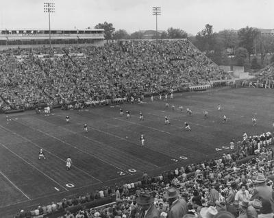 Wide shot of Stoll Field during football game against unidentified team. Photo taken at kickoff moment; Public Relations photo
