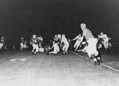 Unidentified football players during game against Louisiana State University