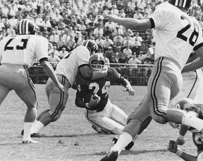 Unidentified football players during game against unidentified opponent. Photo appears on page 215 in the 1969 Kentuckian