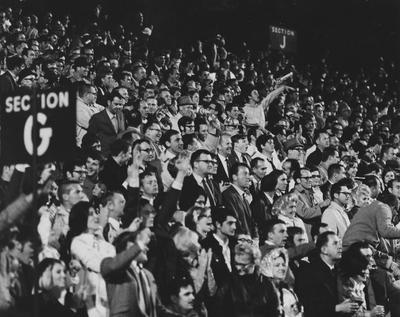 Fans watching football at game, Autumn 1969; photo appears in the football program 