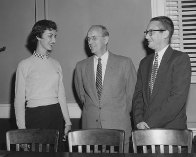 David Dick (far right) and an unidentified woman receive Sullivan scholarships and are standing with UK Vice President Leo Chamberlain, November 3, 1956; Public Relations photo
