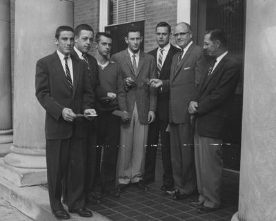 Five students awarded semester scholarship in Dairy Manufacturing, October 10, 1957; names of individuals listed on photograph sleeve along with Frank Welch, Dean of the College of Agriculture and Theodore Freeman, professor of dairying; Louisville Courier-Journal photo