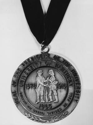 Photo image of the Presidential Medallion worn by John W. Oswald at his inauguration in April 1964; photographer R. R. Rodney Boyce & Associates