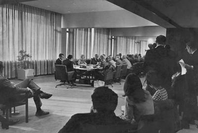 The first University of Kentucky Board of Trustees meeting the Patterson Office Tower, December 1969; Kentucky Governor Louie B. Nunn at head of table (back to camera), UK President Otis Singletary on left of the Governor, former Governor A. B. Chandler is two down from Singletary; Lexington Herald-Leader photo