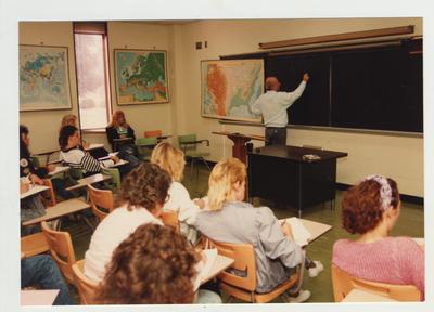 Students listen as Professor McAninch lectures in a classroom