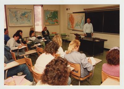 Students listen as Professor McAninch lectures in a classroom