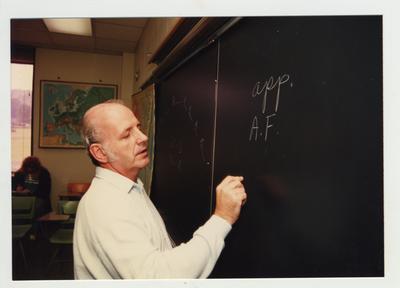 Professor McAninch lectures in a classroom