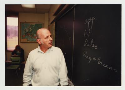 Professor McAninch lectures in a classroom