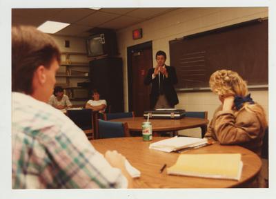 Students listen to a male professor during a lecture