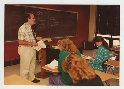 Students listen to an unidentified male professor