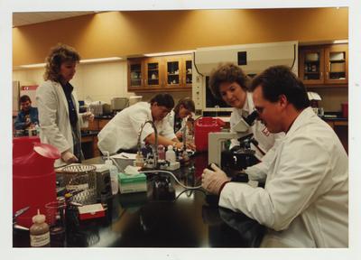 Students perform experiments in a laboratory