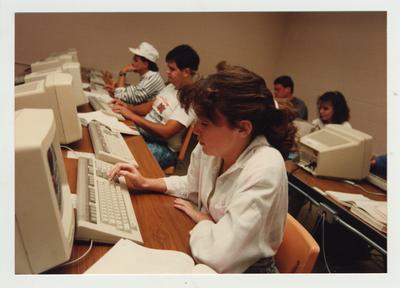 Students work on computers in a classroom