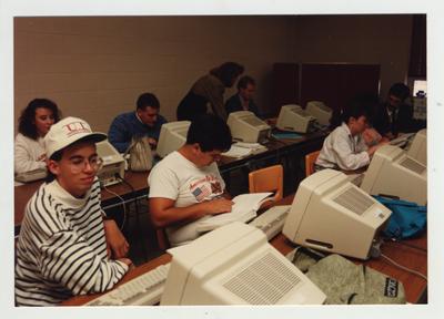 Students work on computers in a classroom