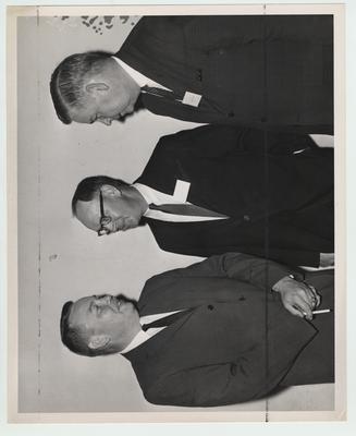 Three men talking; Lexington Herald - Leader staff photo