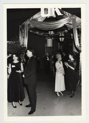 People socializing at the Fellows' Dinner; The woman in the far right in the black dress is Louise Roselle