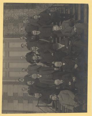 State College of Kentucky 1900; Front row, from left to right: Ruric N. Roark, Principal of the Normal School; James G. White, Head of Department of Mathematics and Astronomy; Dean of the College of Arts and Sciences; President James Kennedy Patterson; John H. Neville, Professor of Greek and Latin, Dean of Classical Faculty; Joseph William Pryor, Head of Department of Anatomy and Physiology; Second Row: Paul Wernicke, Professor of Modern Languages; (Alfred M. Peter, Chemist); John L. Logan, Assistant Professor in Academy; Clarence W. Mathews, Dean of College of Agriculture; (Robert Lee Blanton, Assistant Professor of Greek and Latin); Merry L. Pence, Professor of Physics; Jospeh H. Kastle, Professor of Chemistry; Third Row: Charles R. Sturdevant, Assistant Professor of Electrical Engineering; (John T. Faig, Professor of Machine Design); Milford White, Assistant in Normal School; (Frederick Paul Anderson, Dean of Mechanical and Electrical Engineering); John P. Brooks, Professor of Civil Engineering; (William T. Carpenter, Commandant); Henry E. Curtis, Cheif of Fertilizer Division, Experiment Station; Donated by T. W. Scholtz