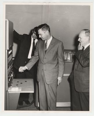 Dr. John W. Hawbfeu, President Frank Dickey, and vice - president Leo Chamberlain