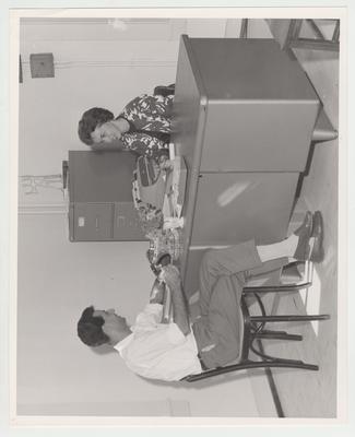 Mrs. Preston White, International Student Advisor, in her office with a student
