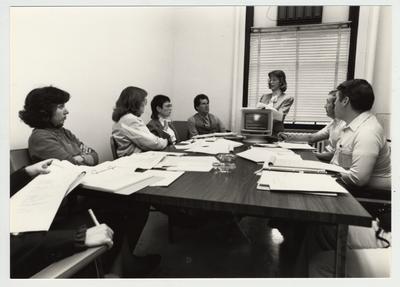 Gail Kennedy (left), Mike Lach (fourth from left) and Phillip Planck (second from right) and Ben Rice (right), of the Computer Center; Submitted for use the the 1983 / 1984 annual Report