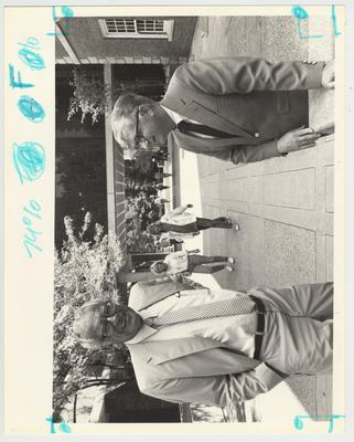 President Otis Singletary (left) with Paul Willis, director of the libraries, in front of the bridge that connected M. I. King South (left) to M. I. King North (right)