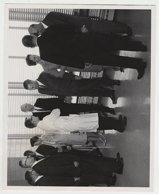 Dr. Willard (fifth from right), President Frank Dickey (fourth from right), and unidentified men and women conversing at the Medical Center dedication