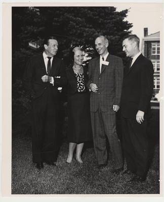 President Frank Dickey (right), Dean William Willard (second from right), and others converse outside at the Medical Center dedication