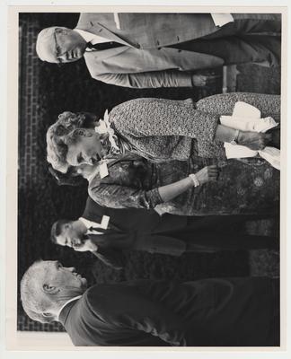 Mrs. Willard (center) and others converse outside at the Medical Center dedication