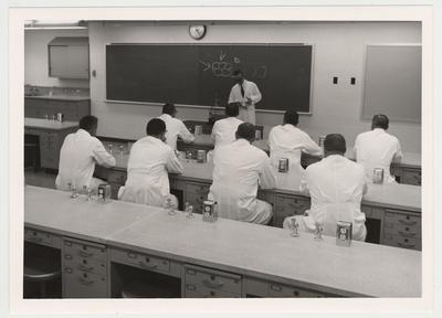 Dr. Roy Durocher, Director of Clinics at the UK College of Dentistry teaching; The Student Techniques Laboratory on the sixth floor, is equipped with closed circuit television