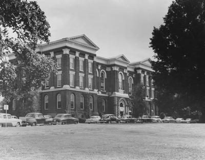 Administration Building with cars parked in front circle; photo appears in 1957 Kentuckian, page 16; Photographer:  Thomasson-Smith