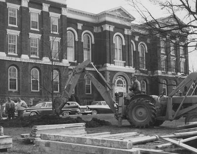 Administration Building, heavy equipment digging in front of building; Public Relations photo