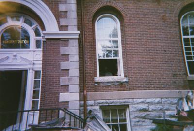 Administration Building fire, May 15, 2001; exterior at President' office window; President Charles Wethington seen through window, though image is obscured