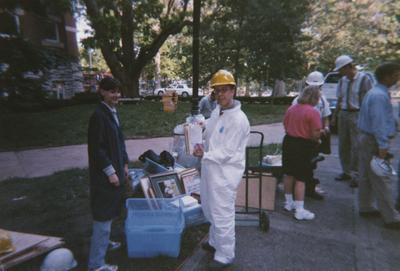 Administration Building fire, May 15, 2001; left to right, Whitney Baker, Conservator, Tom Rosko, UARP, Peggy Way, President's Administrative Aide, Dall Clark (blue shirt, no helmet), Procurement and Construction, and Fred Wells, building operator/supervisor (in suspenders talking with Peggy)