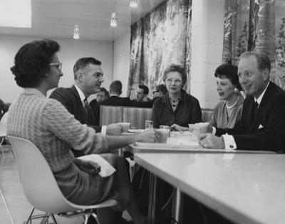 University President and Mrs. Frank G. Dickey, left, Marie Fortenberry, Director of Food Services, center, and Dean of Men and Mrs. Leslie L. Martin, right, having breakfast at the opening of UK's fourth student grill; Public Relations photo