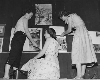 Camp Robinson; interest group, from left, Bobbie Johnson, Morell Compton, and Omeda Salyers, arranges and art gallery