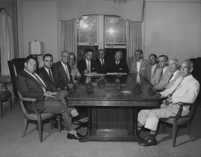 Members of Carnahan House Board, 1960-61, are pictured at the September meeting; left to right are William H. McCubbin, Clay Maupin, Vincent E. Nelson, Helen King, R. W. Wild, Frank J. Ogden, Frank D. Peterson, Morris Scherago, W. Lloyd Mahan, J. Ed Parker, Jr., Penrose Ecton, and Richard Allison; Robert Hillenmeyer was not present