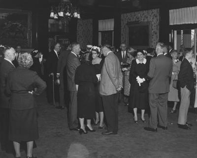 Unidentified groups socializing at the reception of the Carnahan House dedication