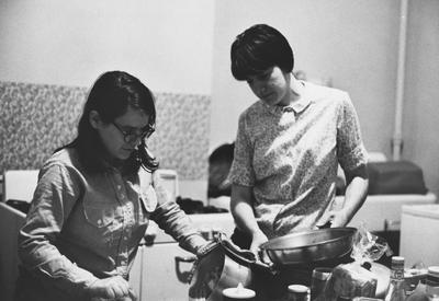 Two unidentified students are preparing a meal in the Dillard House. This photo is second on page 202 of the 1969 