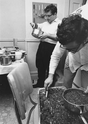 Two unidentified students are preparing a meal in the Dillard House. This photo is second on page 163 of the 1969 